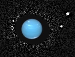 Наложение снимков Нептуна и его спутников (newscientist.com)