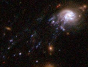 Галактика, от которой отходят линии рождающихся звезд (newscientist.com)