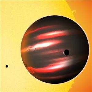 Практически черная планета TrES-2b, изредка показывающая красноватое свечение (ras.org.uk)